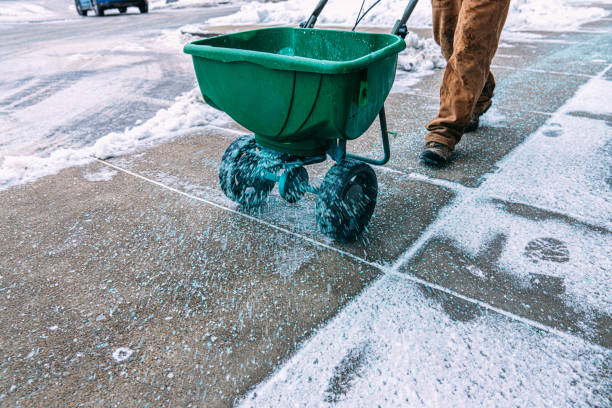 Professional snow and ice removal service with salt spreader equipment by HB Lawncare
